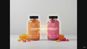 Vitamin bottles on light background